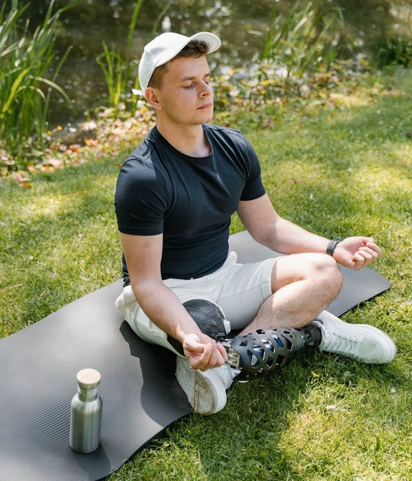 Man performing a strength exercise in a calm, focused environment.